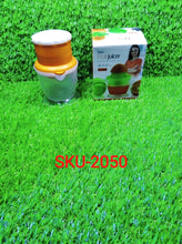 Compact manual orange juicer for efficient juice extraction at home.